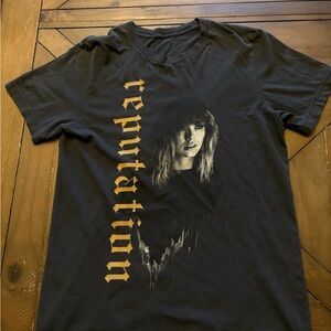 Taylor Swift Reputation Black Graphic T-Shirt with Gold Lettering.